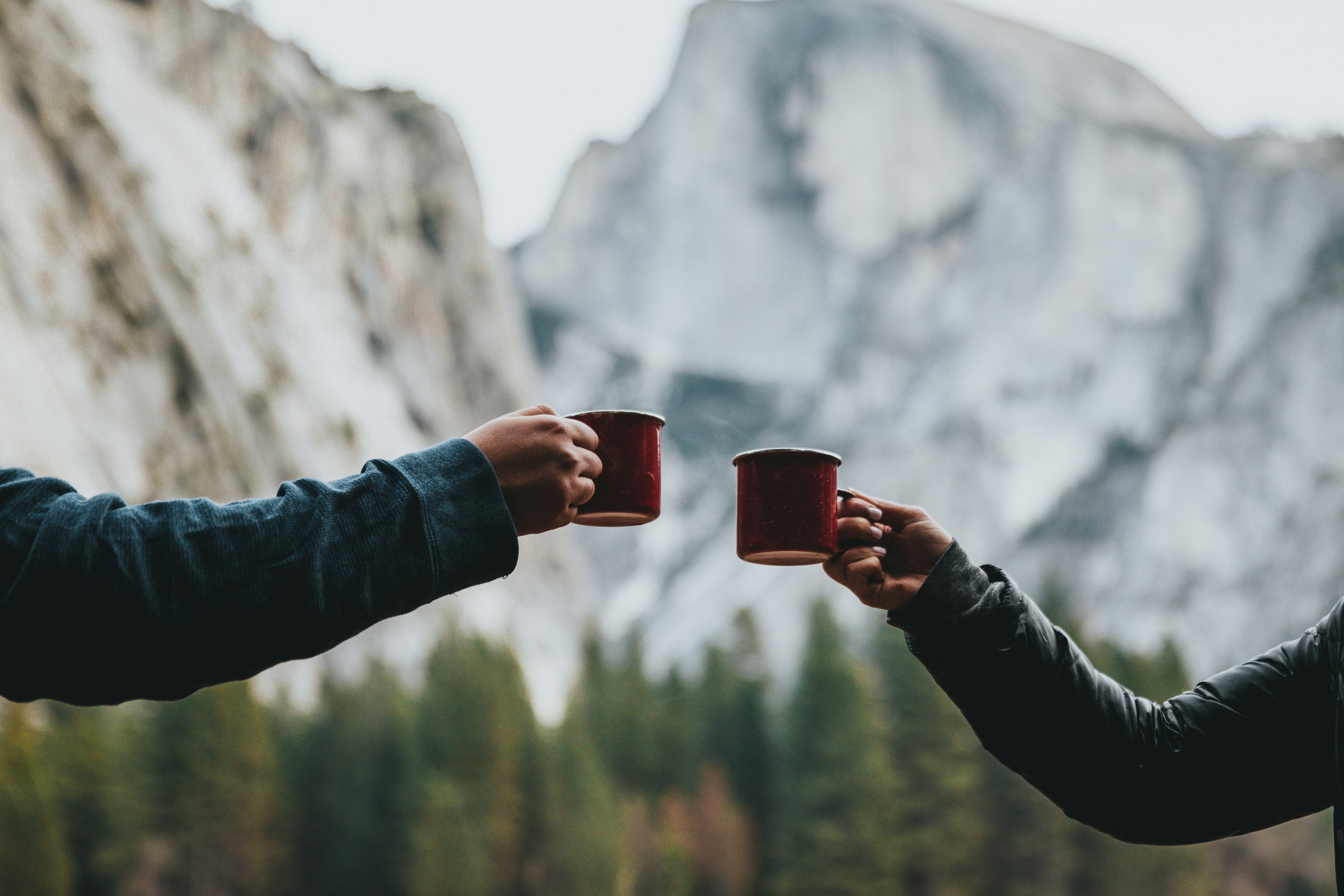 two people in the mountains drinking k9 coffee
